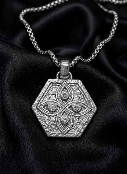 White gold hexagon shield with diamond watchers on silk, protection amulets tradition
