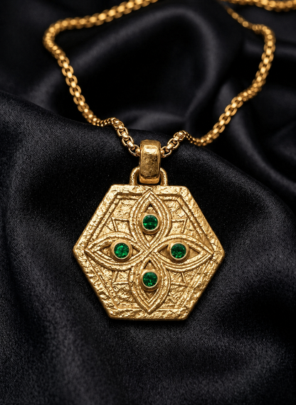 Gold Tibeb hexagon with emerald watchers on chain, a symbol of protection in 18k