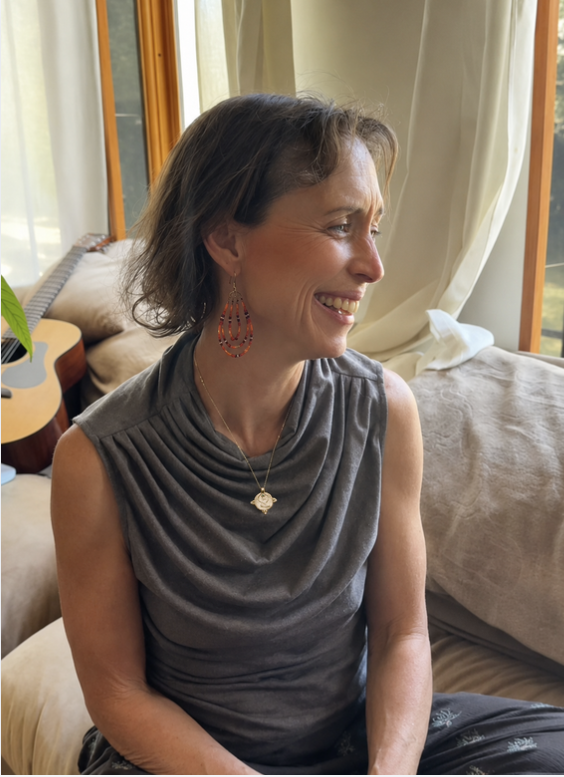 Customer wearing the white gold Eternal Mother pendant daily, a wearable art jewelry review