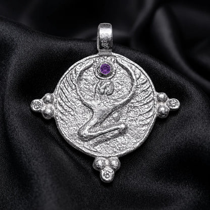 White gold winged goddess disc with amethyst crown stone, an egyptian amulet form on silk