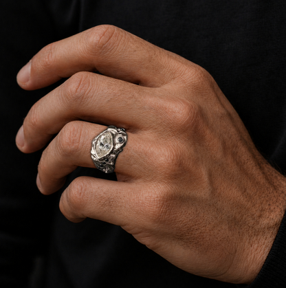 White gold Horus ring on a man's hand, mens african jewelry in a sculpted signet weight form