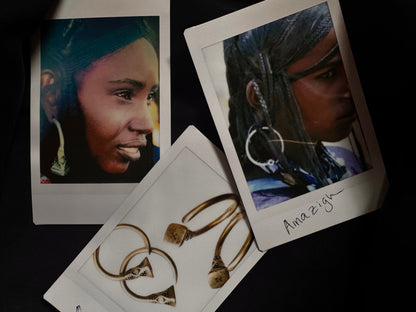 Polaroids of Amazigh women wearing Tizabaten hoops, traditional African jewelry of the Sahara