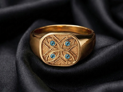 Yellow gold signet with sapphire watchers, a pinky signet ring in the classic placement