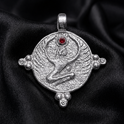 White gold winged goddess pendant with ruby crown stone, an Egyptian goddess necklace