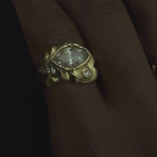 Marquise of Horus Ring in solid 18k gold rotating in light, eye of horus ring with marquise diamond