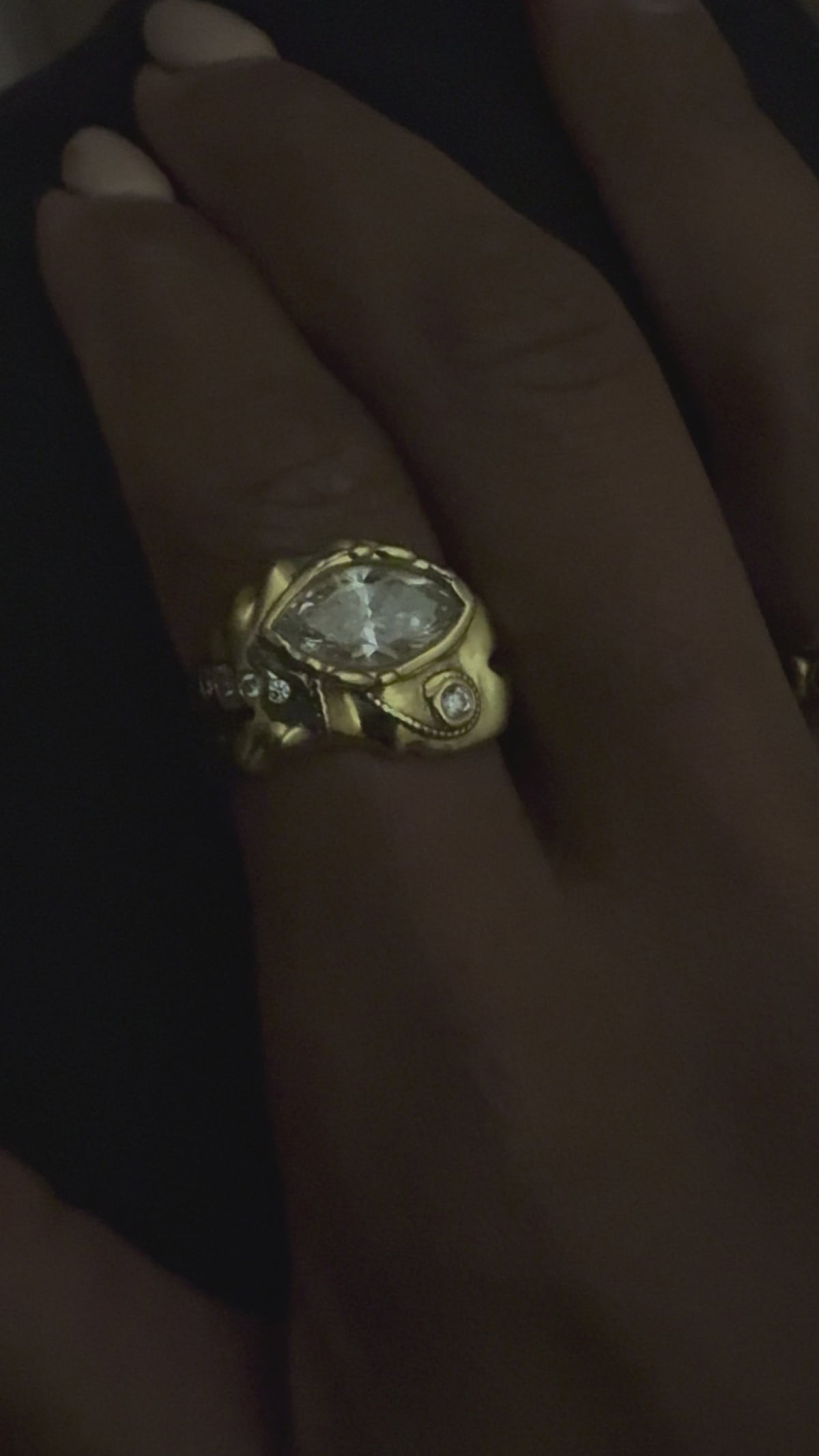 Marquise of Horus Ring in solid 18k gold rotating in light, eye of horus ring with marquise diamond