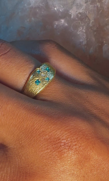 Video of the gold Meskel ring with emerald stones worn on hand over rose quartz stone